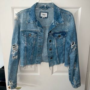 Slightly cropped ripped jean jacket